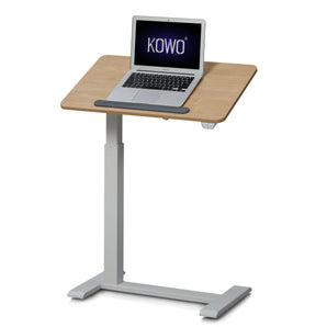 KOWO tilted top cordless small standing desk in maple colour. This adjustable laptop stand features a gas spring mechanism that allows for seamless tilting of the tabletop to your desired angle. It also comes with a rechargeable battery so no need to find a power outlet. 