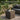 Dark brown rattan weave and tempered glass top detail on outdoor side table