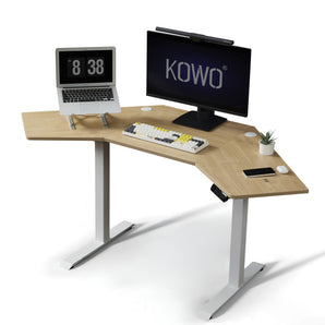 KOWO K314 corner standing desk in oak colour. Its spacious tabletop can easily fit a computer dual monitors and laptop. 